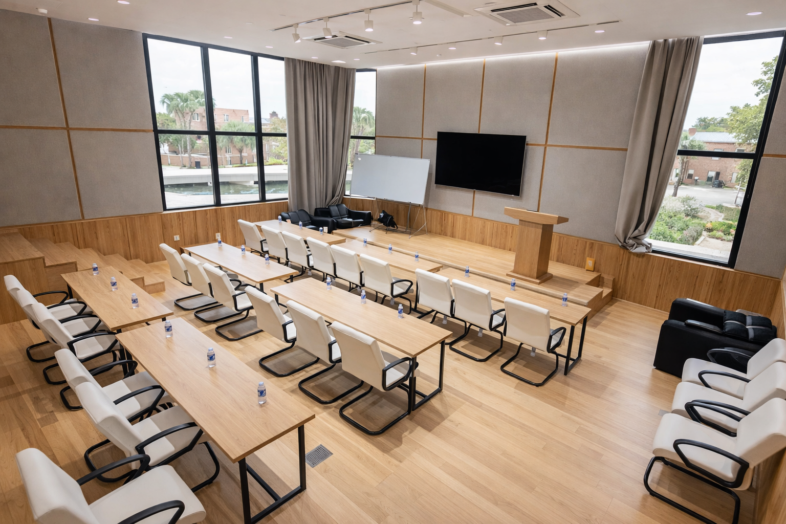 Bright seminar room with wood floors and presentation space